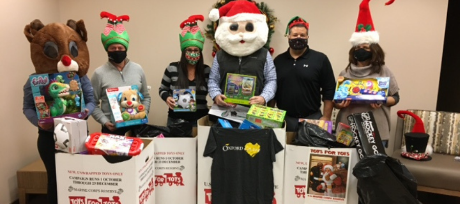 Oxford team members participating in Toys for Tots