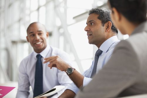 Three men in a meeting